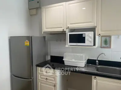 Modern kitchen with sleek appliances and elegant cabinetry