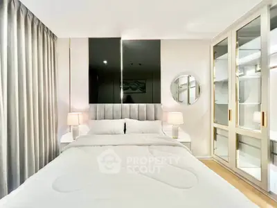Luxurious bedroom with elegant decor and ample storage in modern apartment