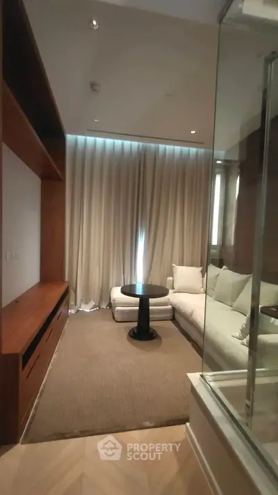 Cozy living room with modern sofa and elegant wooden accents