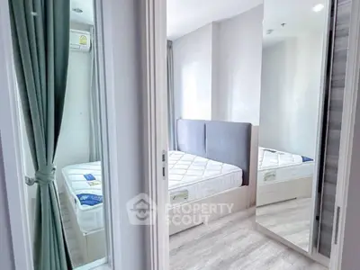 Modern bedroom with mirrored closet and stylish decor