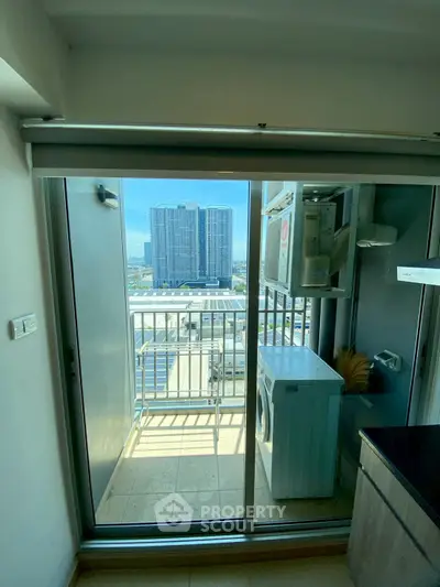 Modern apartment balcony with washing machine and city view