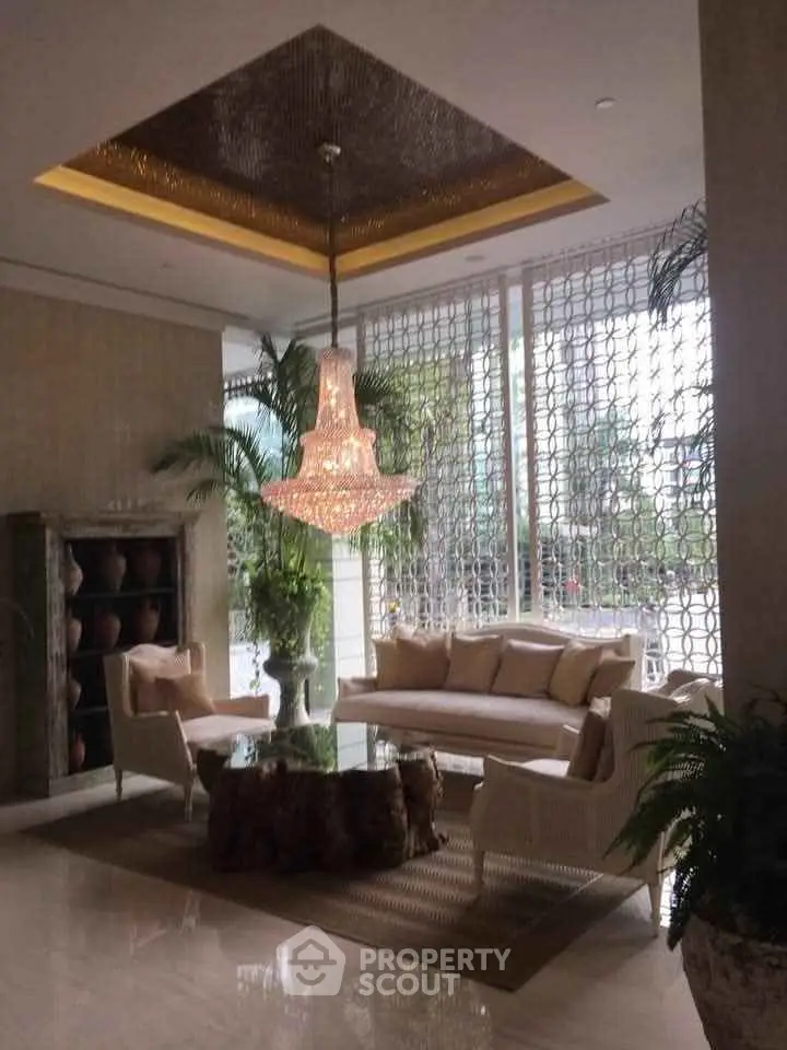 Luxurious living room with elegant chandelier and stylish decor