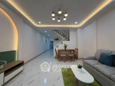 Spacious modern living room with elegant lighting and stylish furniture, perfect for family gatherings.