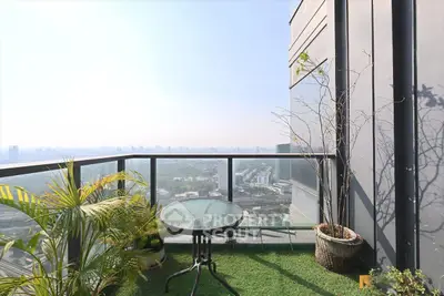 Stunning balcony with panoramic city view and lush greenery