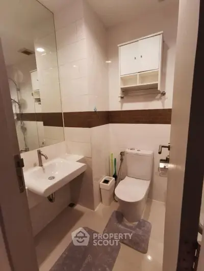 Modern bathroom with sleek fixtures and ample storage space