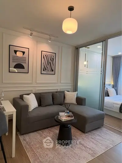 Modern living room with stylish decor and cozy seating area in a contemporary apartment.