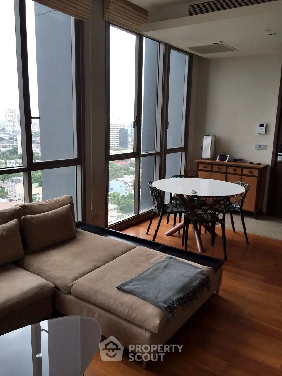 Modern living room with panoramic city view and stylish furniture
