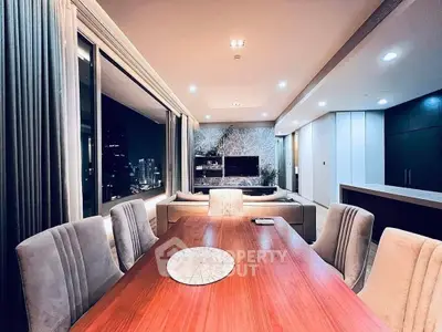 Luxurious modern living room with elegant dining area and stunning city view.