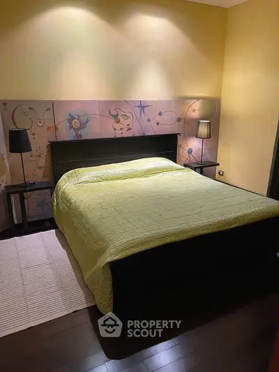 Cozy bedroom with artistic headboard and ambient lighting, perfect for relaxation.