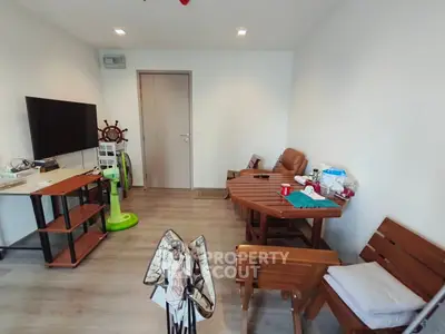 Cozy living room with wooden furniture and modern TV setup