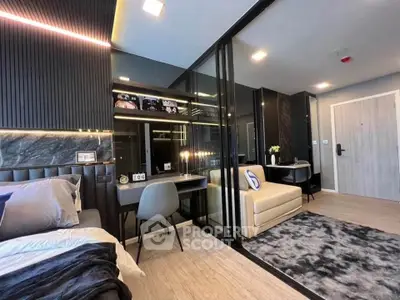 Modern studio apartment with sleek design, featuring a cozy bed, stylish desk, and elegant decor.