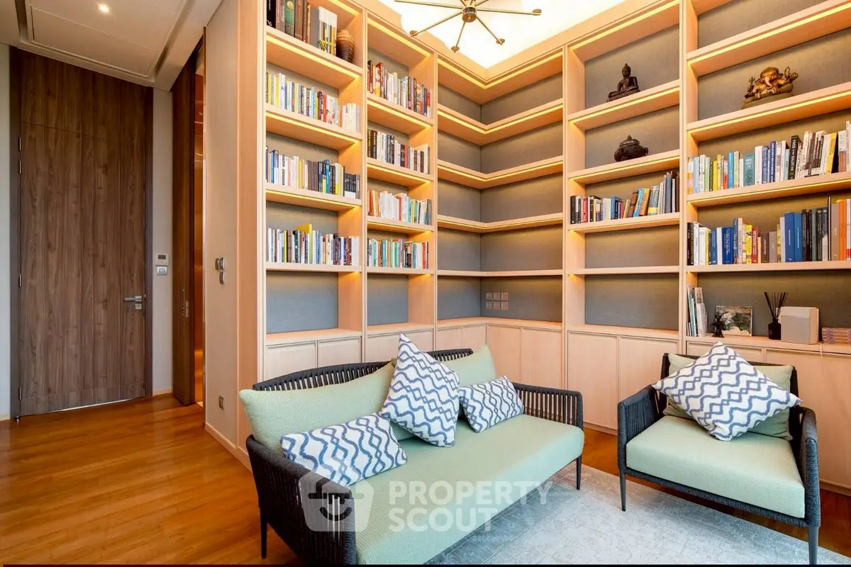 Luxurious home library with elegant bookshelves and cozy seating area, perfect for relaxation and reading.