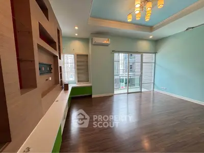 Spacious living room with modern design and large windows for natural light