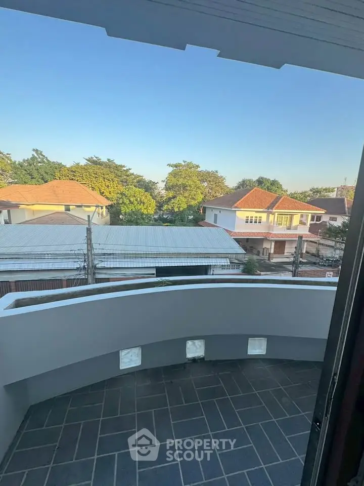 Charming balcony with scenic neighborhood view, perfect for relaxing and enjoying the outdoors.