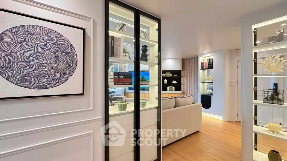 Modern living room with elegant decor and stylish shelving in a contemporary apartment.