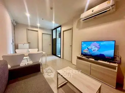 Modern living room with sleek furniture and air conditioning, perfect for relaxation and entertainment.