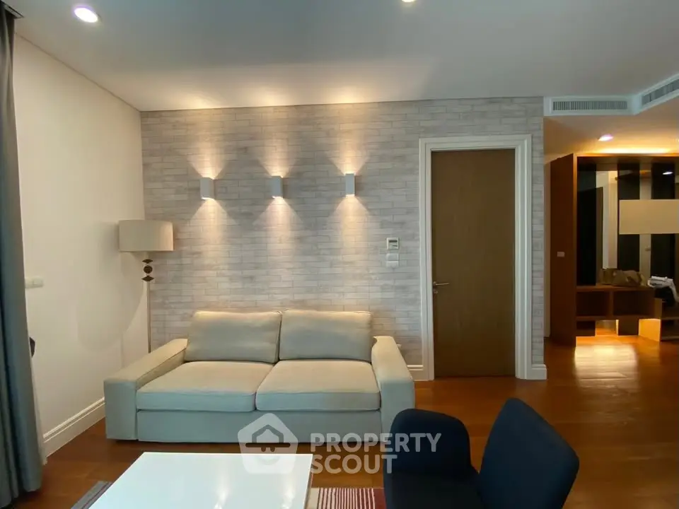 Modern living room with cozy sofa and stylish lighting