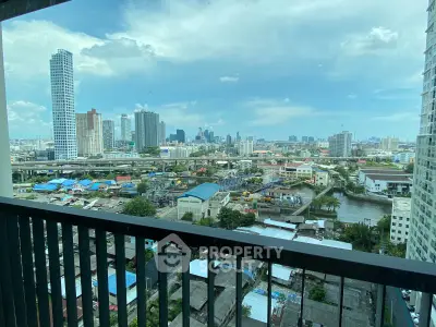 Stunning cityscape view from a high-rise balcony overlooking urban skyline and river.