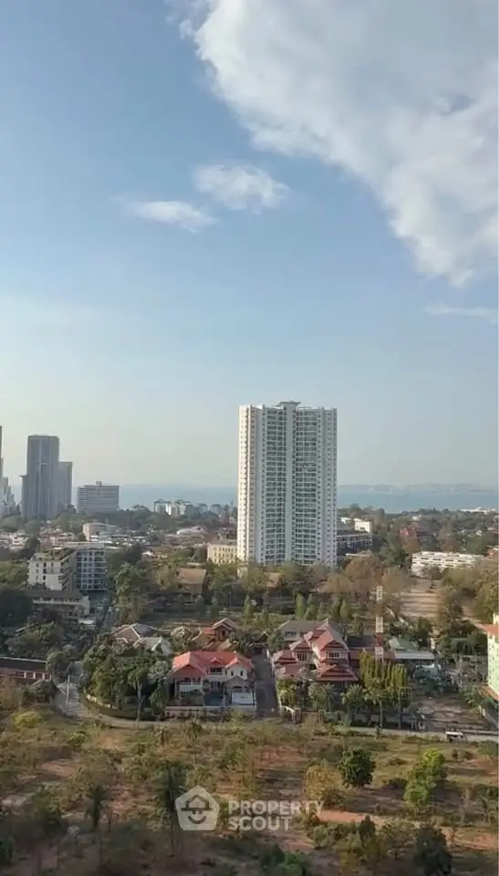 Stunning high-rise building with panoramic cityscape and lush greenery views.