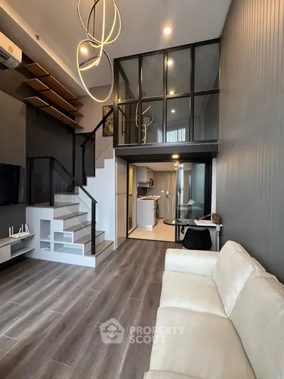 Modern duplex living room with stylish staircase and open kitchen layout