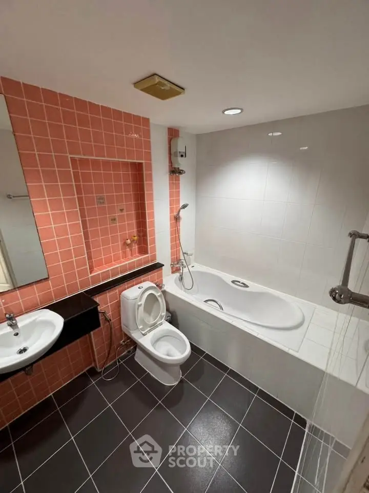 Modern bathroom with bathtub and stylish tile design