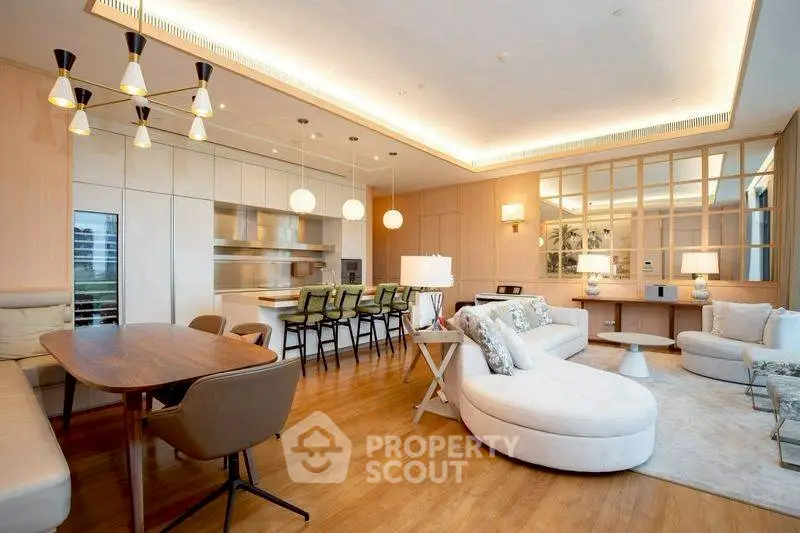 Luxurious open-plan living room with modern kitchen and elegant lighting
