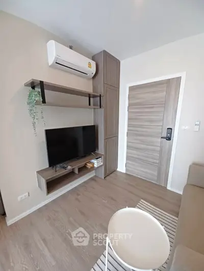 Modern living room with air conditioning and stylish wooden furniture