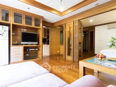 Spacious living room with wooden accents and modern entertainment setup