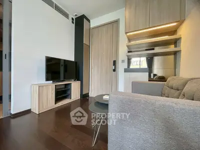 Modern living room with sleek furniture and wooden flooring