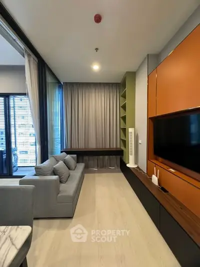 Modern living room with sleek design and large window view