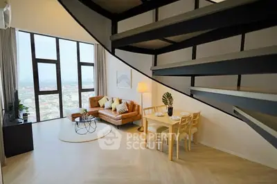 Modern loft with spiral staircase, stylish living area, and panoramic city views.
