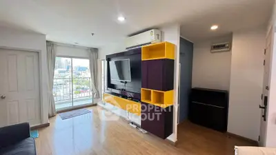 Modern living room with vibrant shelving and city view balcony