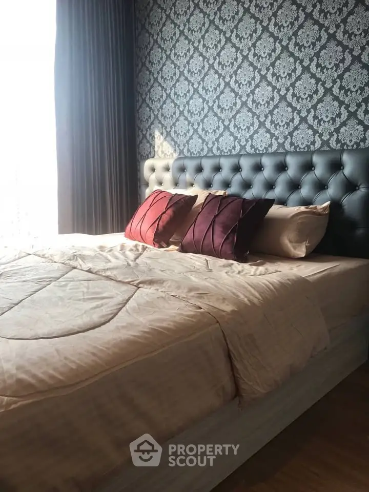 Luxurious bedroom with elegant wallpaper and plush bedding