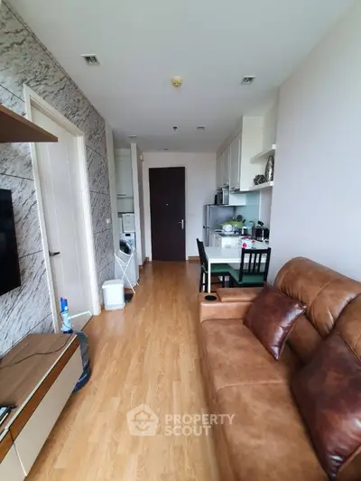 Modern apartment interior with cozy living room and compact kitchen