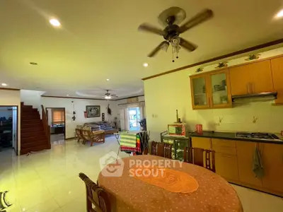 Spacious open-plan living room and kitchen with modern amenities and stylish decor.