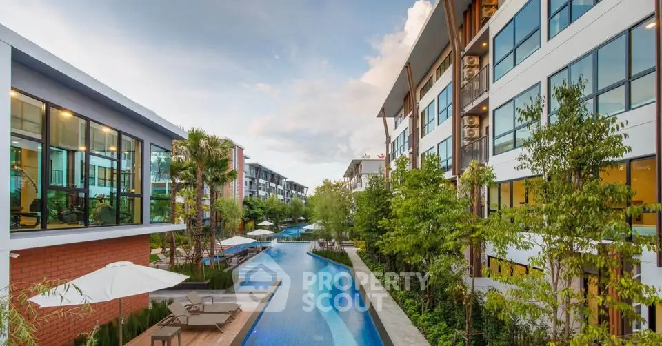 Luxurious modern apartment complex with stunning pool and lush greenery