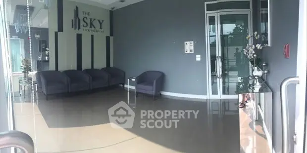 Modern apartment lobby with sleek seating and stylish decor