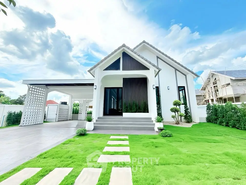 Charming modern house with lush green lawn and spacious driveway, perfect for family living.