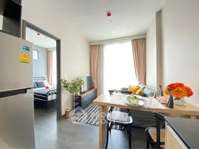 Modern apartment interior with open layout, stylish dining area, and cozy living space.