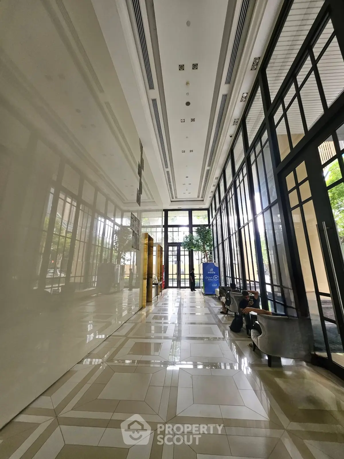 Luxurious building entrance with high ceilings and elegant design