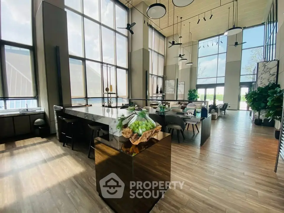 Spacious modern living room with high ceilings and large windows