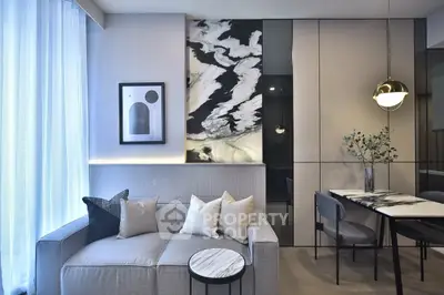 Modern living room with elegant decor and dining area