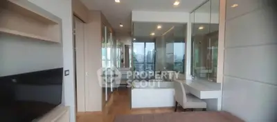 Modern bedroom with city view, featuring sleek design and ample natural light.