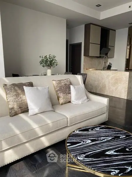Luxurious modern living room with elegant sofa and stylish kitchen in open layout