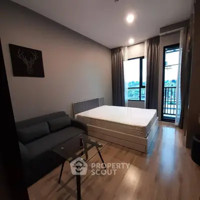 Modern bedroom with balcony view in stylish apartment