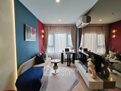 Modern living room with stylish decor and large windows