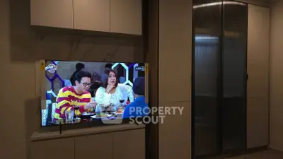 Modern living room with built-in TV cabinet and sleek design