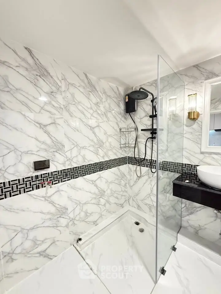 Luxurious marble bathroom with modern fixtures and elegant design