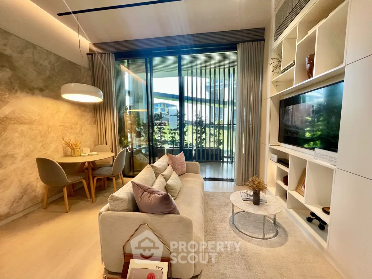 Modern living room with cozy seating and elegant dining area, featuring large windows and stylish decor.