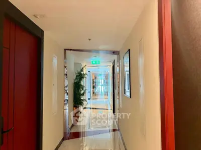 Elegant hallway with modern decor and polished floors in upscale building